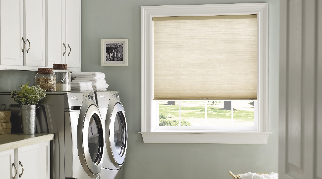 Laundry room with roller shades